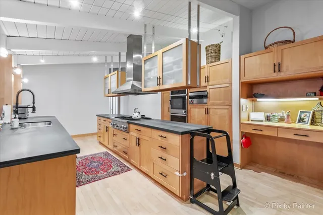 a living room with furniture flat screen tv and a large window