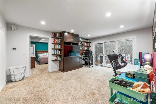 a bedroom with furniture and a flat screen tv