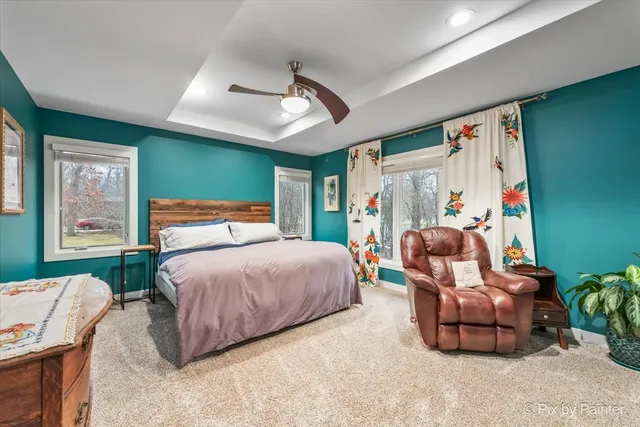 a bathroom with a bathtub and a large mirror