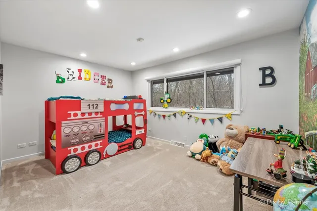 a bedroom with a large bed and a large window