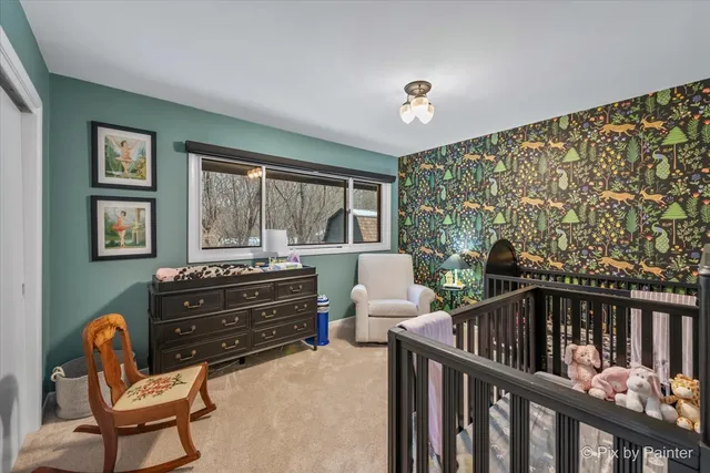 a living room with furniture and large windows