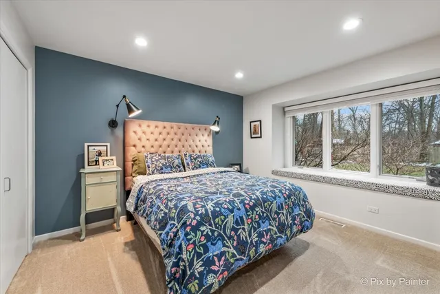 a spacious bathroom with a sink mirror and vanity