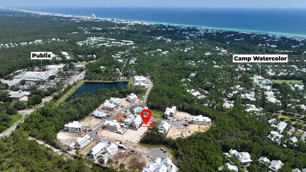 an aerial view of multiple houses with outdoor space