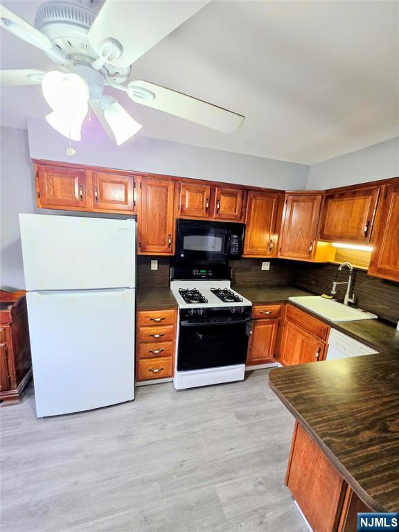 245 Beech Street, Unit 2 Kearny, NJ 07032 - Photo 1 of 16 a kitchen with stainless steel appliances granite countertop a stove a refrigerator and a stove