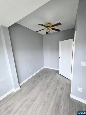 a bathroom with a white tub and shower