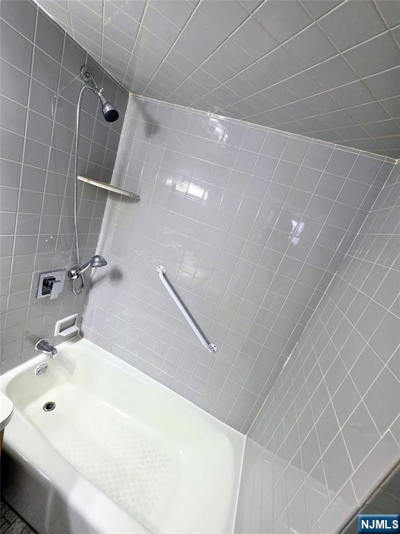 245 Beech Street, Unit 2 Kearny, NJ 07032 - Photo 12 of 16 a bathroom with a white tub and shower