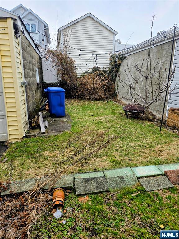 245 Beech Street, Unit 2 Kearny, NJ 07032 - Photo 15 of 16 a backyard of a house with lots of green space