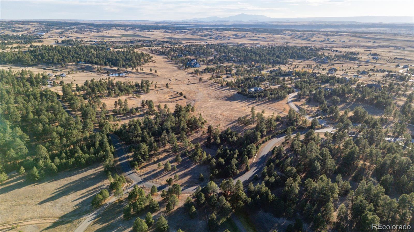 N/a Woodhaven Ridge Road Parker, CO 80134 - Photo 14 of 36 an aerial view of residential houses with city view