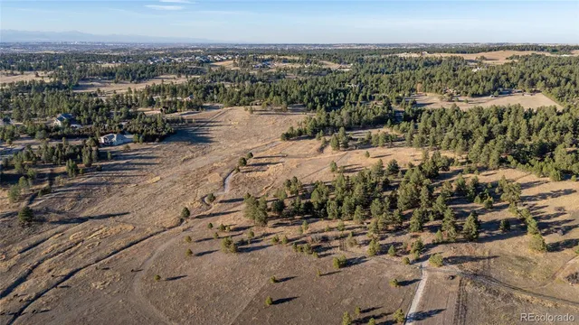 a view of a chairs and table in the patio