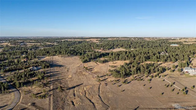 a view of a lake with houses in the back
