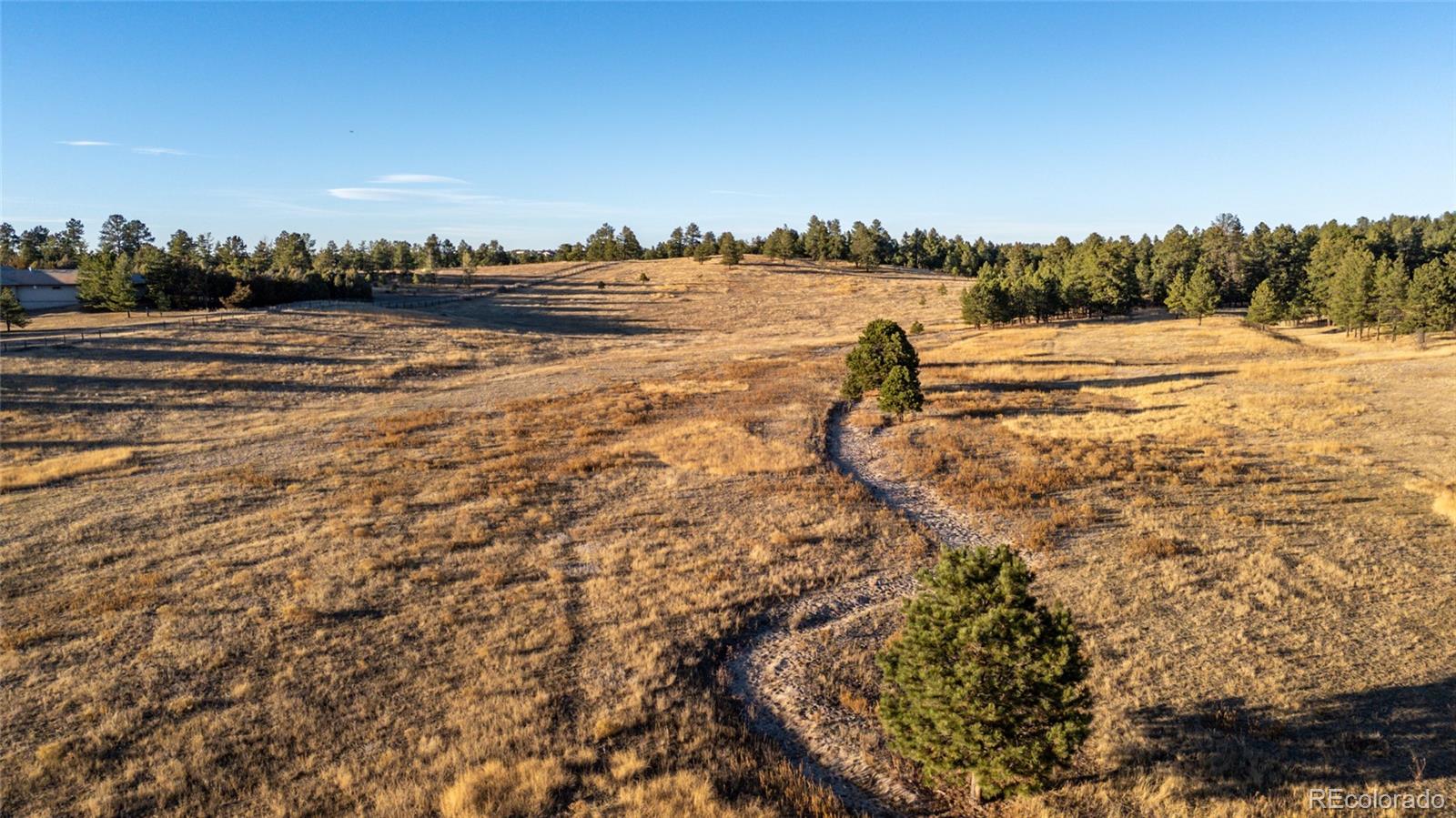 N/a Woodhaven Ridge Road Parker, CO 80134 - Photo 21 of 36 a view of a lake with houses in the back