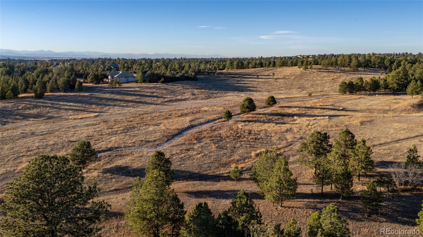 N/a Woodhaven Ridge Road Parker, CO 80134 - Photo 22 of 36 a view of a lake with a beach