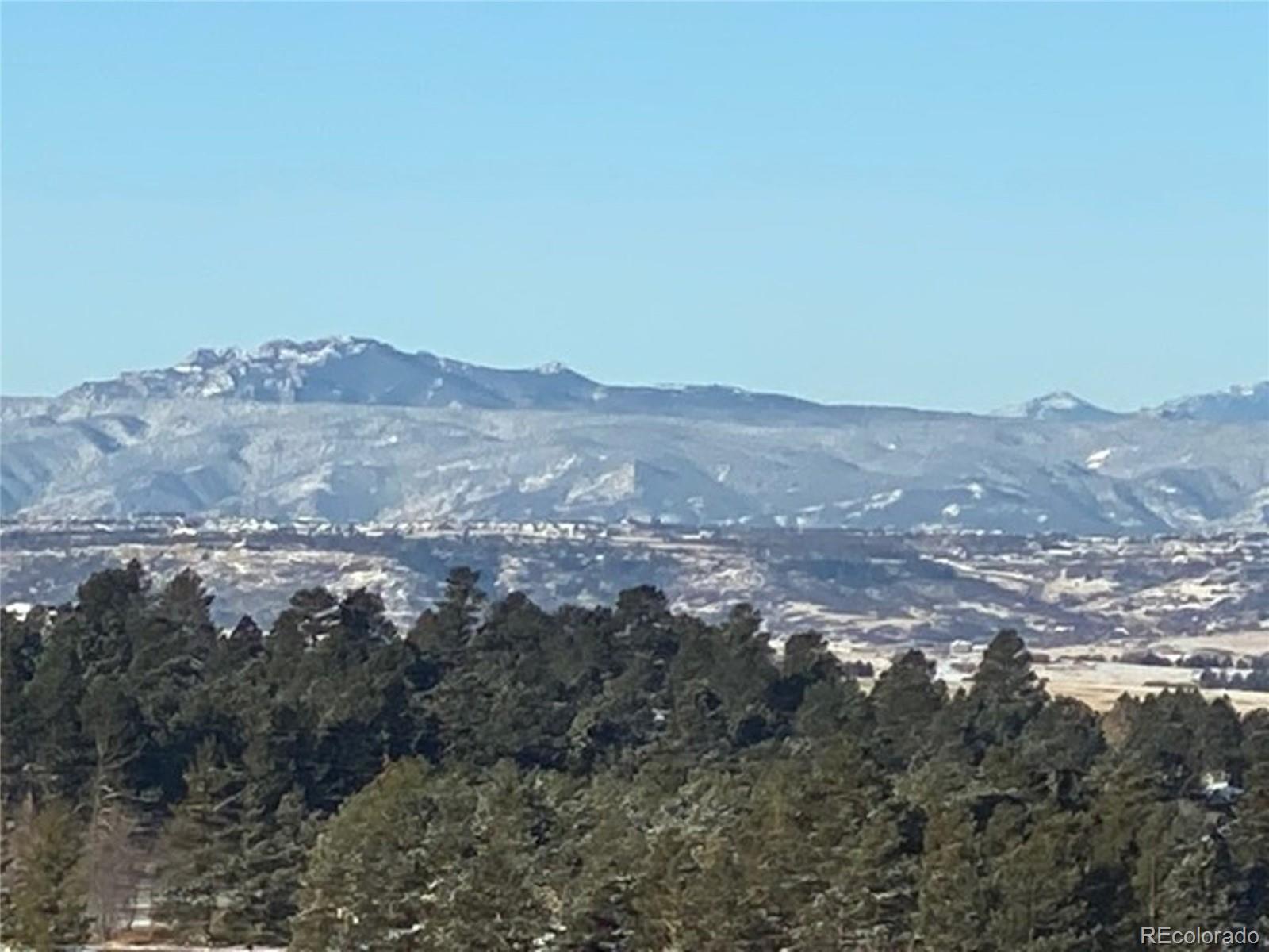 N/a Woodhaven Ridge Road Parker, CO 80134 - Photo 30 of 36 a view of a big yard with mountains in the background