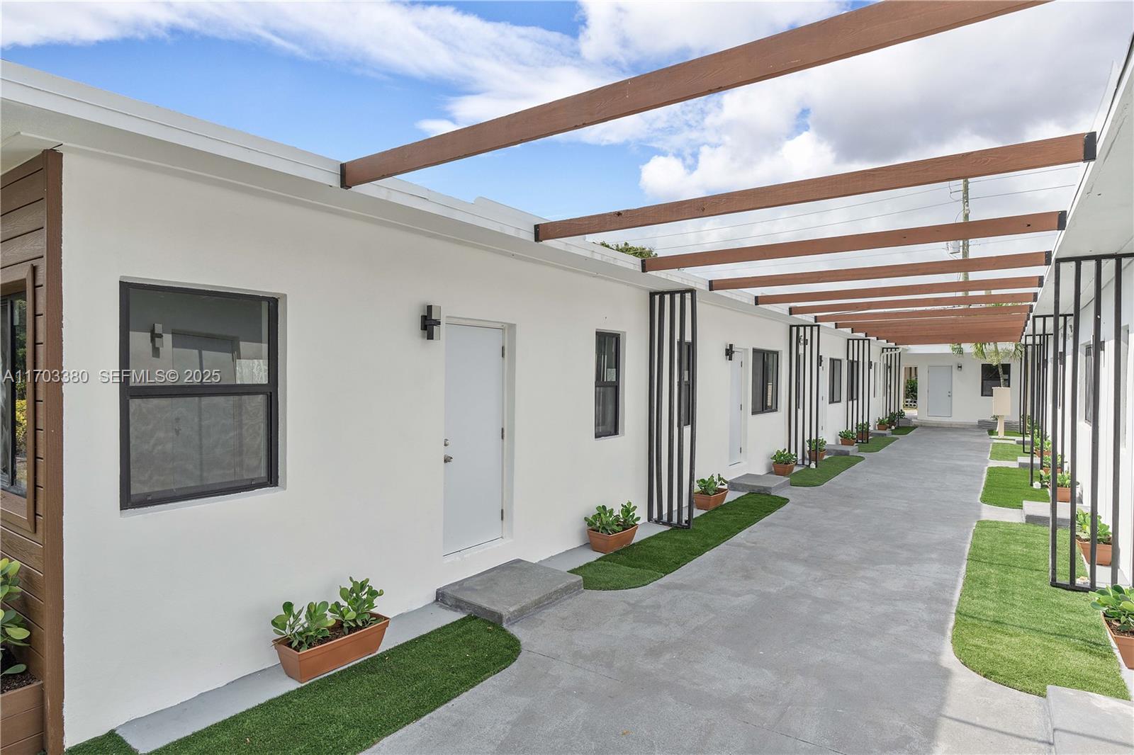 1946 Pierce Street, Unit 3 Hollywood, FL 33020 - Photo 11 of 43 a front view of a house with a porch