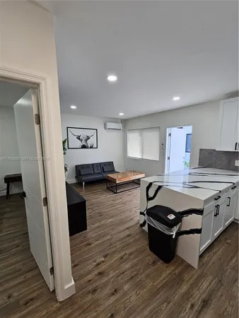 a kitchen with stainless steel appliances granite countertop a stove and a refrigerator