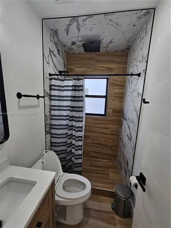 a bathroom with a toilet and a sink