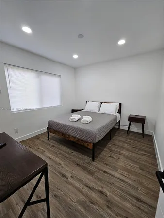 a living room with furniture rug and window