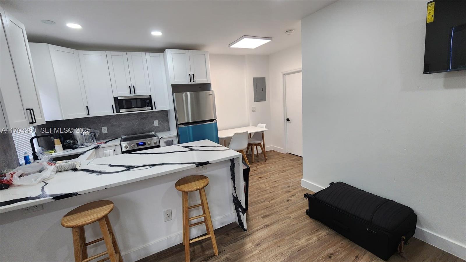1946 Pierce Street, Unit 3 Hollywood, FL 33020 - Photo 34 of 43 a kitchen that has a sink and a stove in it