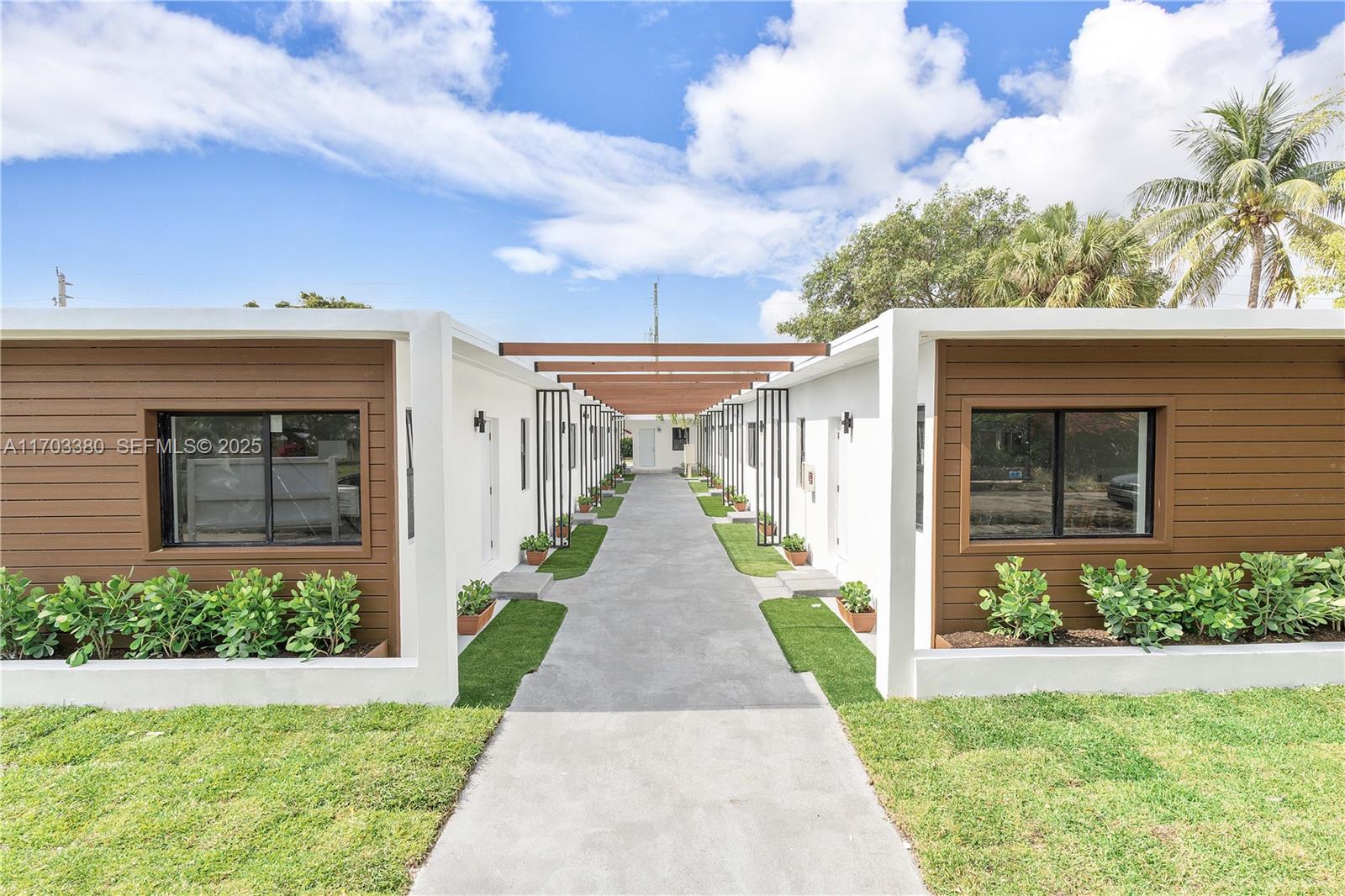 1946 Pierce Street, Unit 3 Hollywood, FL 33020 - Photo 4 of 43 a view of a house with a yard