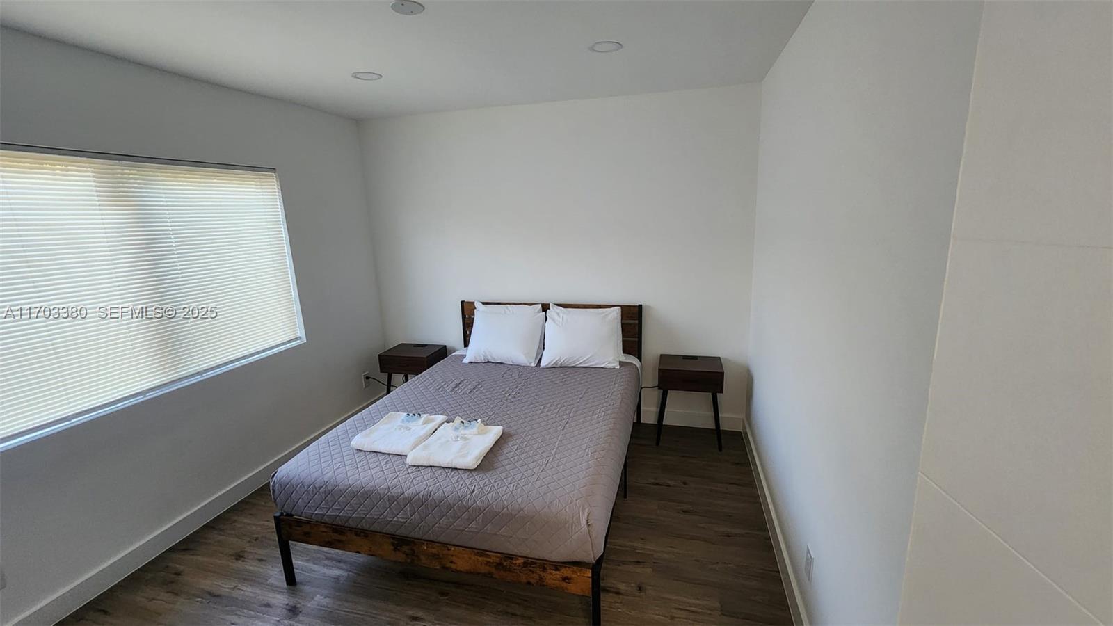 1946 Pierce Street, Unit 3 Hollywood, FL 33020 - Photo 42 of 43 a bedroom with a bed and a window