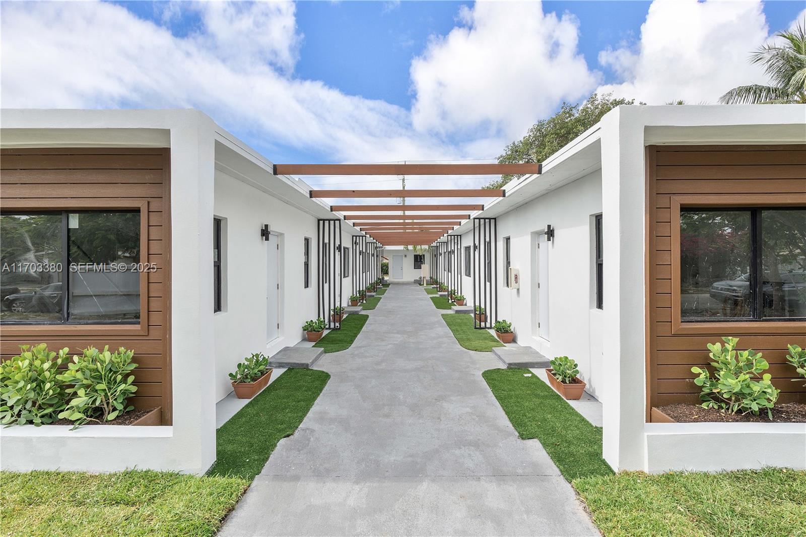 1946 Pierce Street, Unit 3 Hollywood, FL 33020 - Photo 6 of 43 a front view of a house with a porch