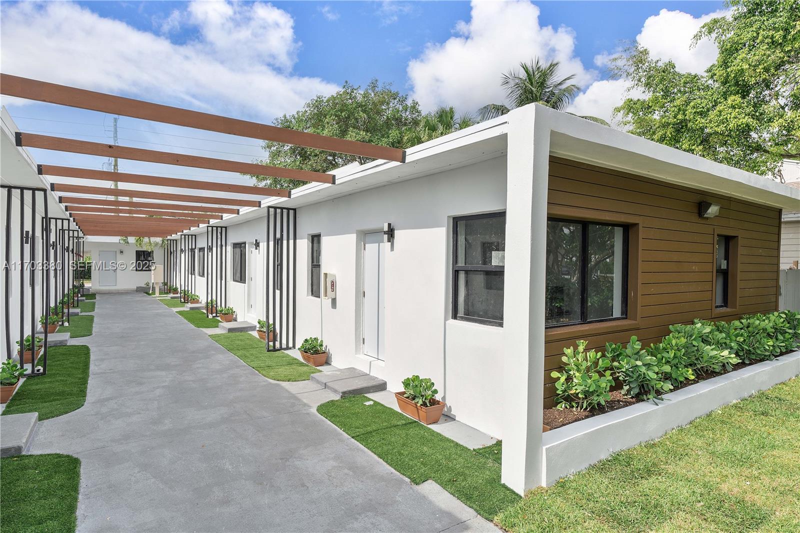 1946 Pierce Street, Unit 3 Hollywood, FL 33020 - Photo 8 of 43 a porch with seating space