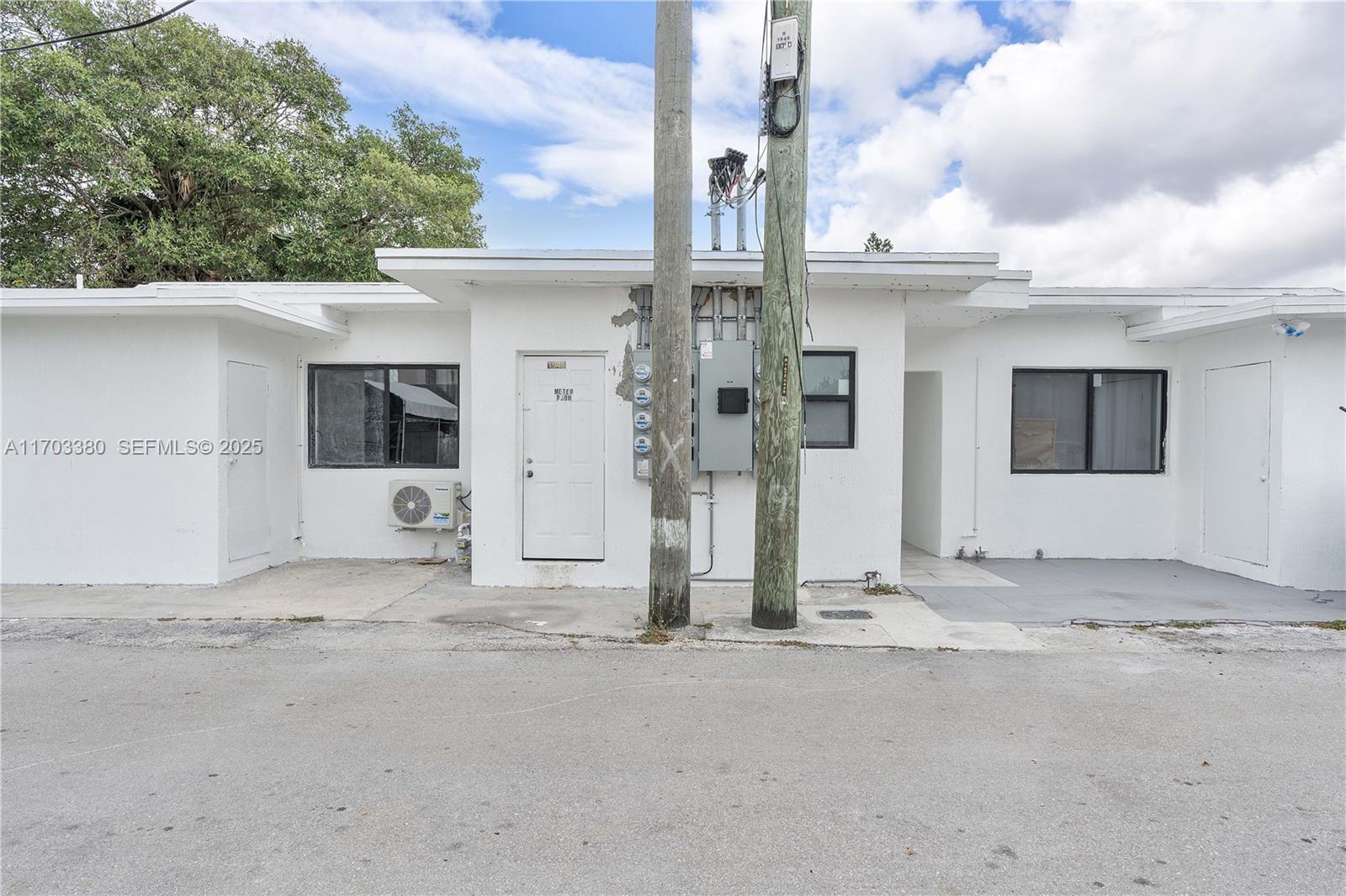 1946 Pierce Street, Unit 3 Hollywood, FL 33020 - Photo 10 of 43 a view of a house with a wooden fence