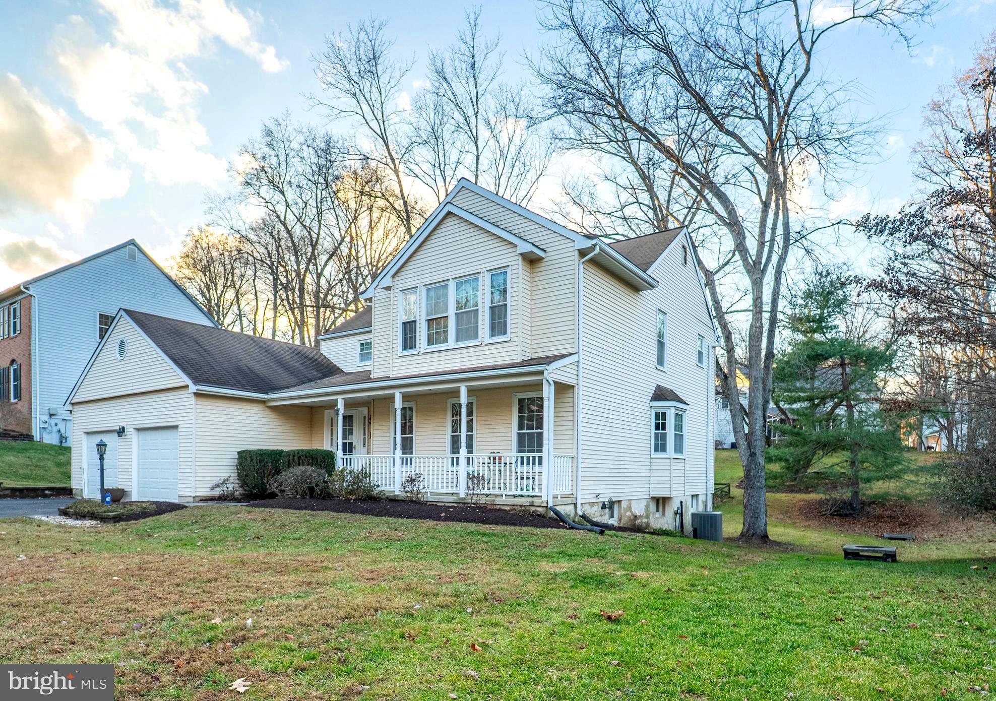 10531 Hunters Way Laurel, MD 20723 - Photo 2 of 42 a view of a yard in front of a house with plants and large tree