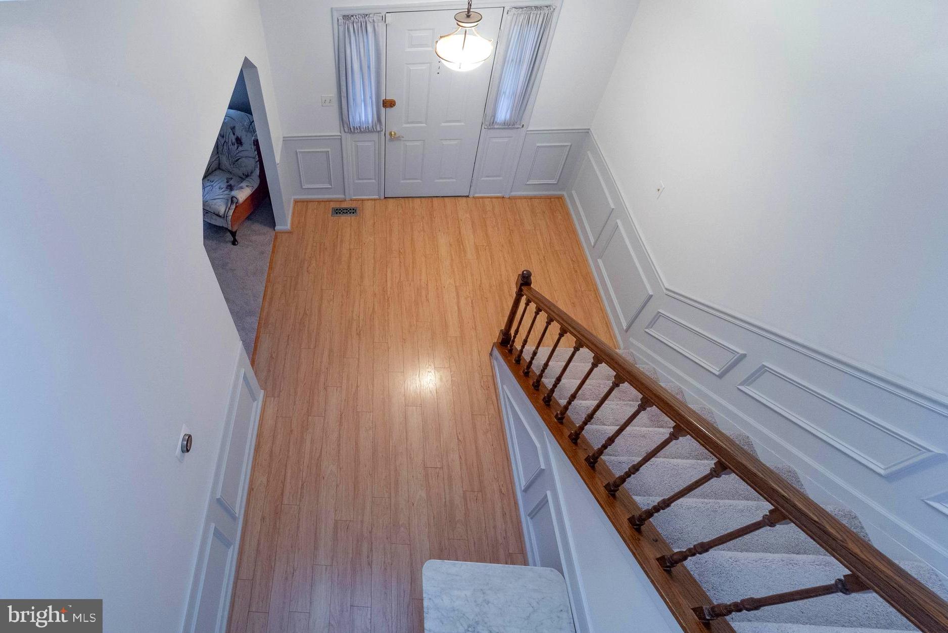 10531 Hunters Way Laurel, MD 20723 - Photo 21 of 42 a view of an entryway with wooden floor