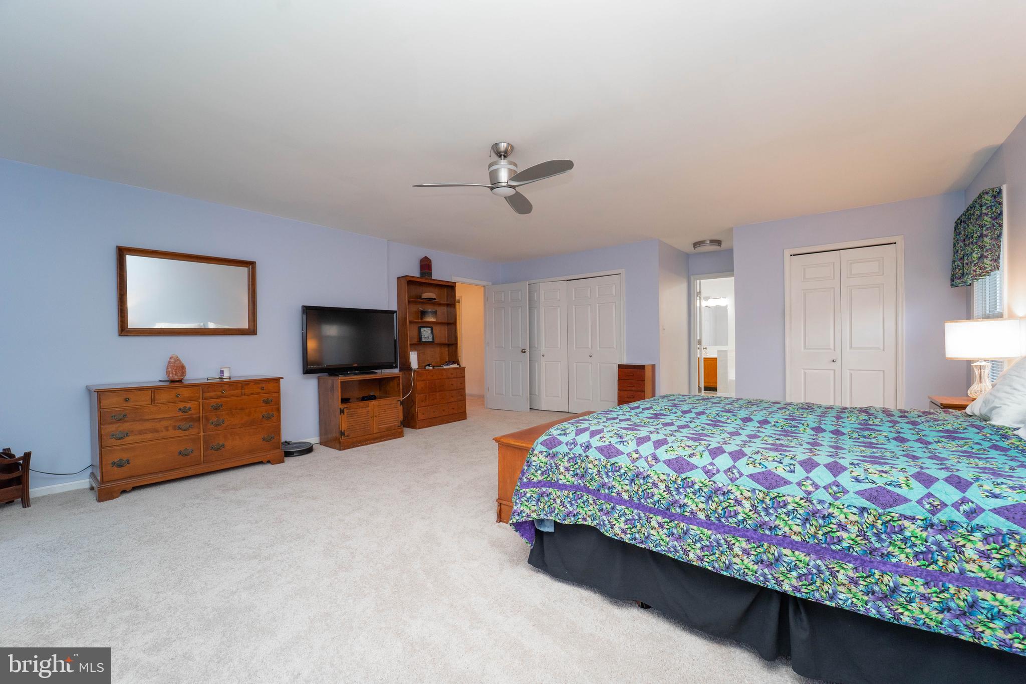10531 Hunters Way Laurel, MD 20723 - Photo 25 of 42 a bedroom with a bed and a tv on the dresser