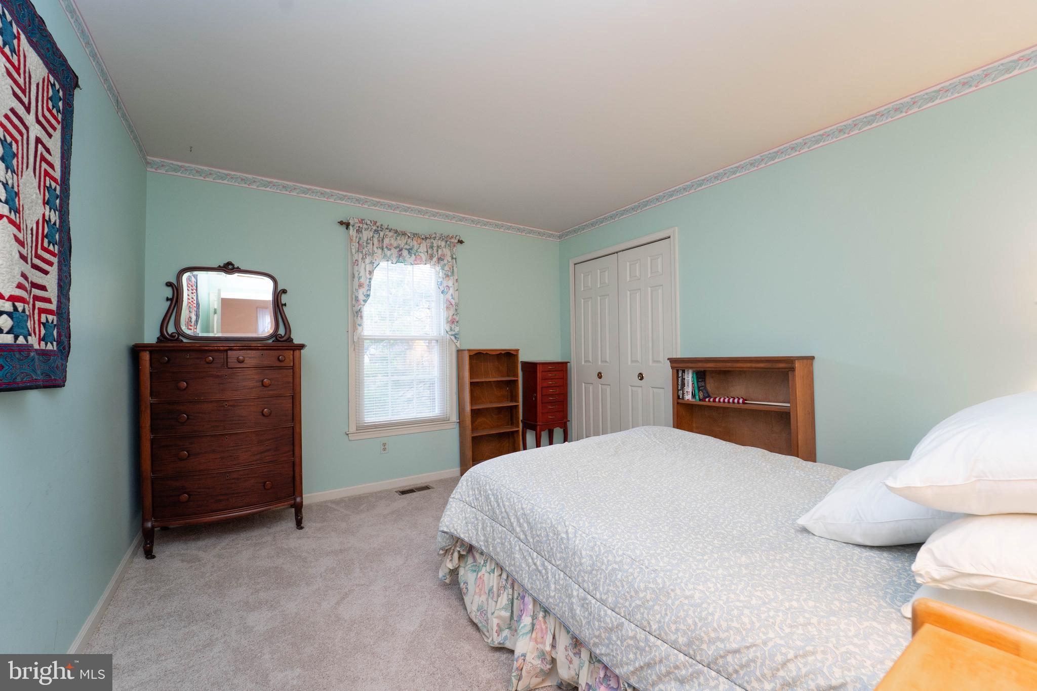 10531 Hunters Way Laurel, MD 20723 - Photo 29 of 42 a bedroom with a bed and dresser