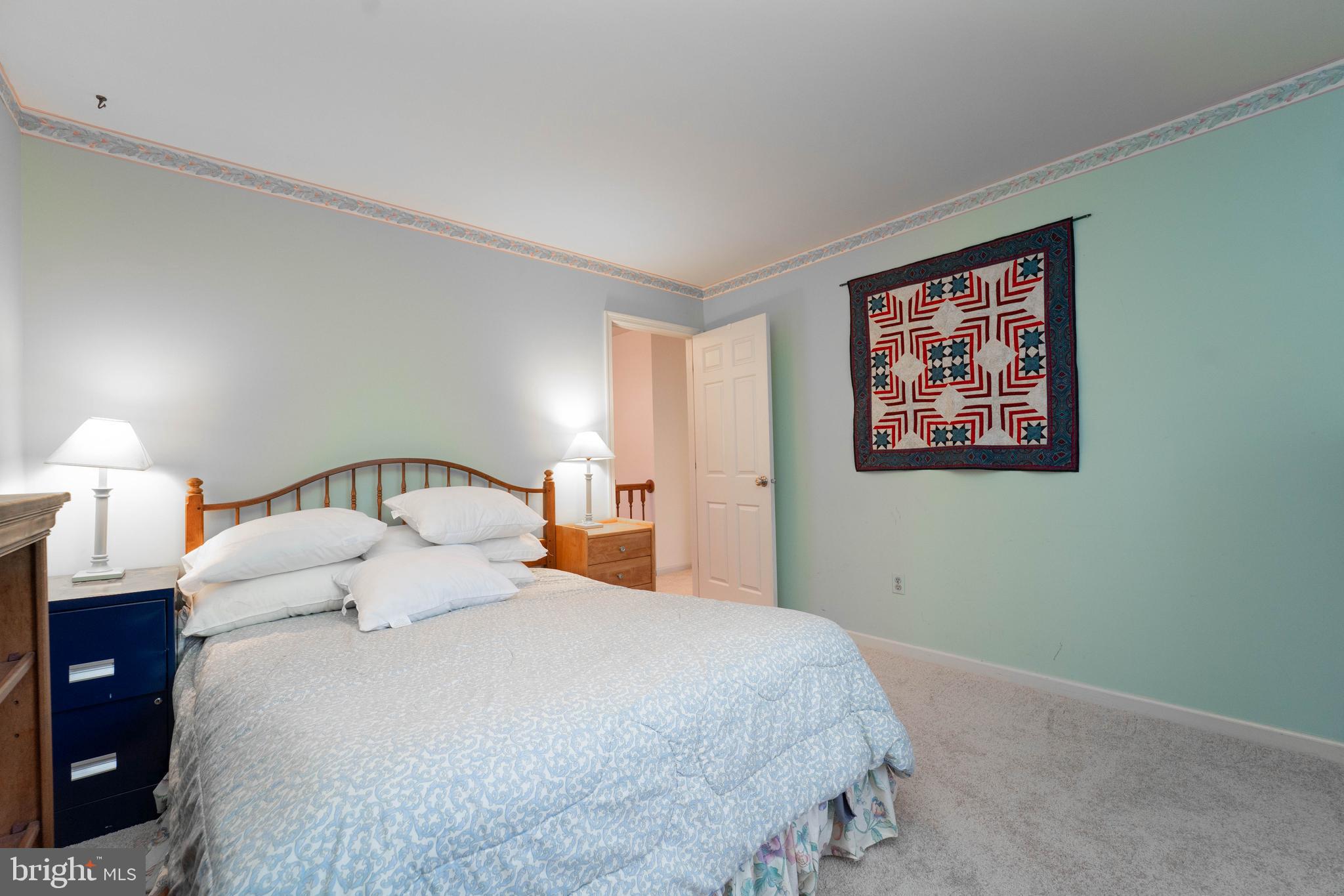 10531 Hunters Way Laurel, MD 20723 - Photo 30 of 42 a bedroom with a bed and a night stand