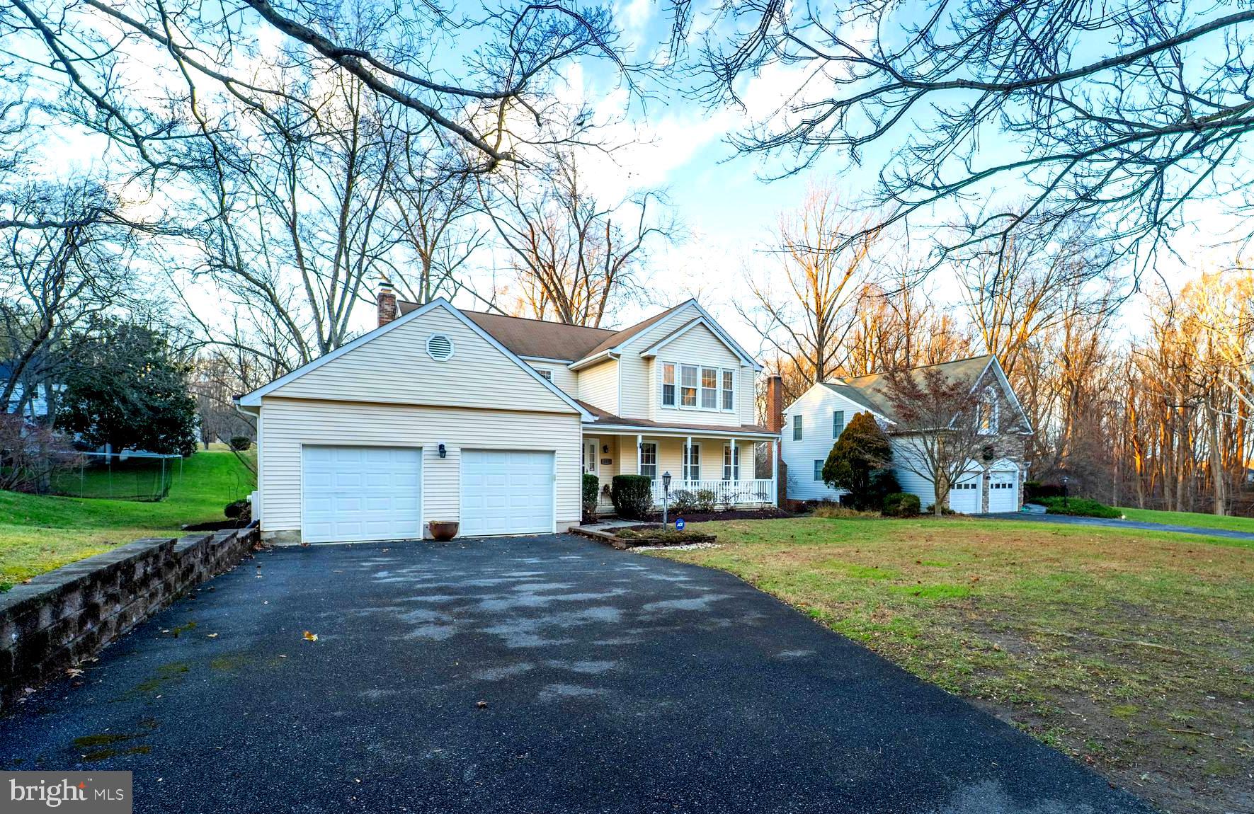 10531 Hunters Way Laurel, MD 20723 - Photo 3 of 42 a front view of a house with a yard and garage