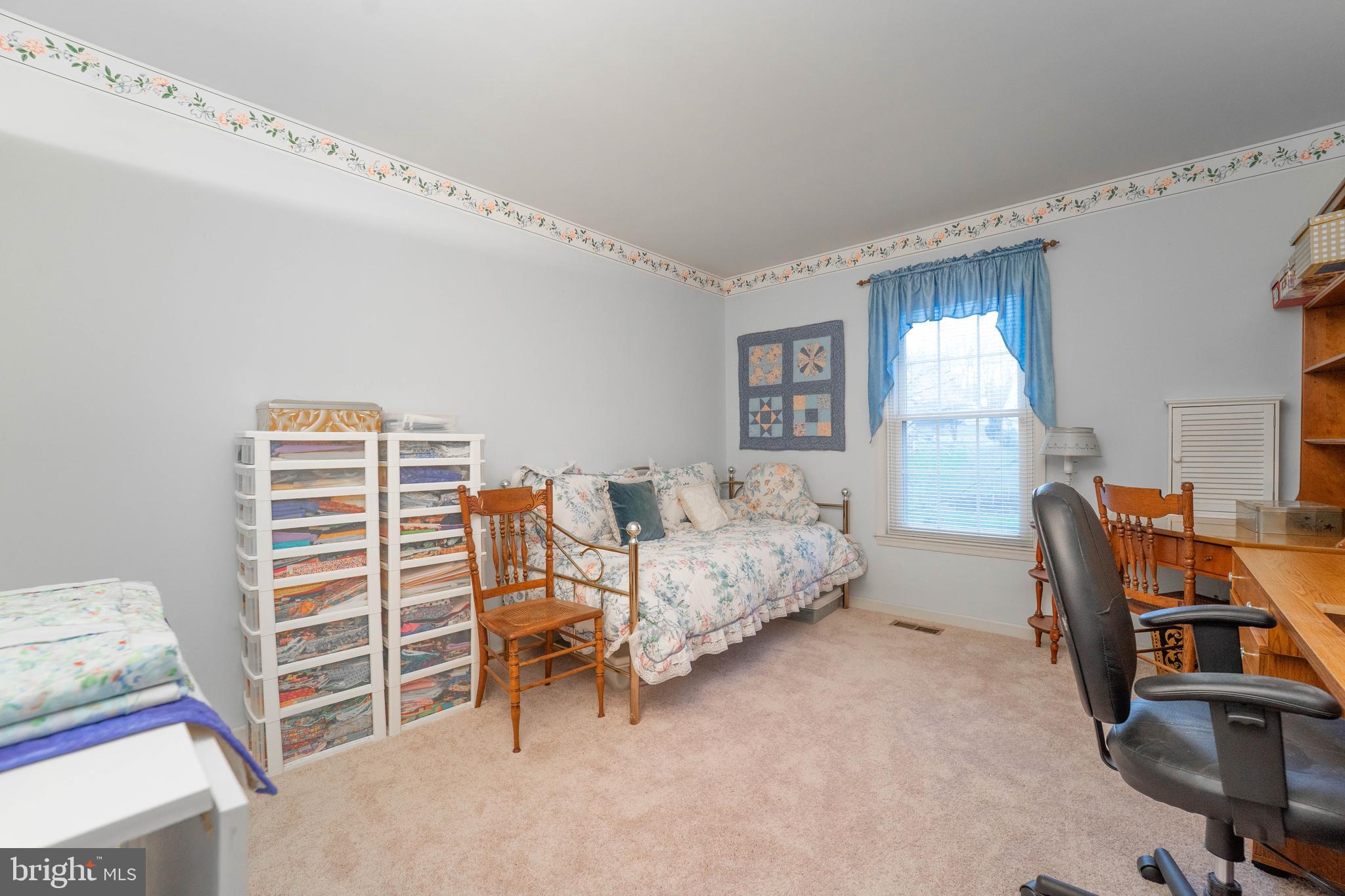 10531 Hunters Way Laurel, MD 20723 - Photo 31 of 42 a bedroom with furniture and a window