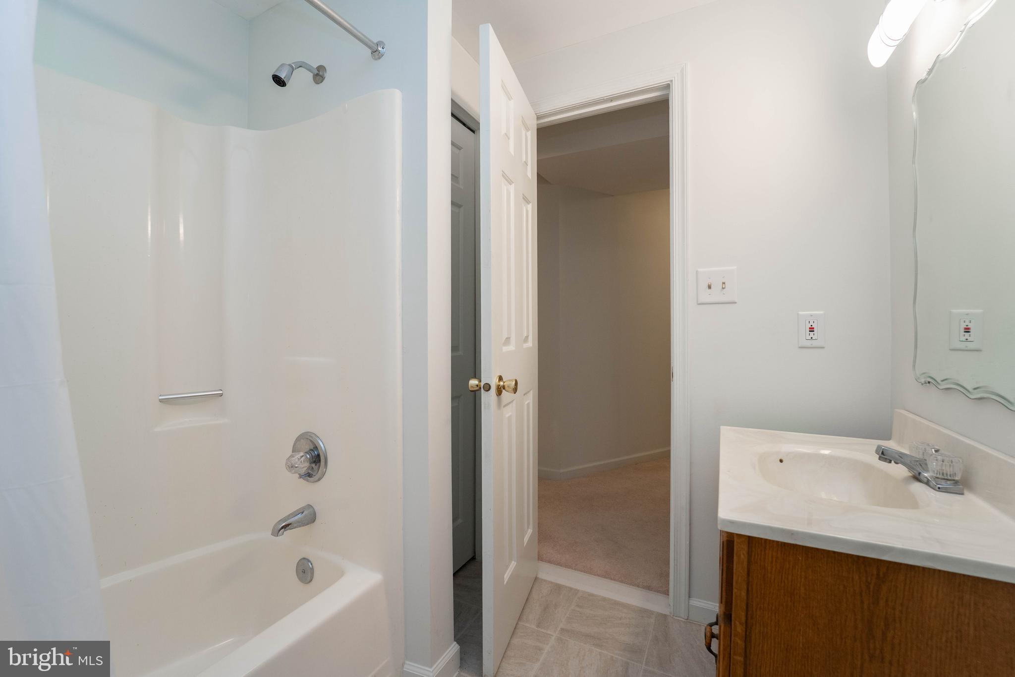 10531 Hunters Way Laurel, MD 20723 - Photo 37 of 42 a bathroom with a sink and a bathtub