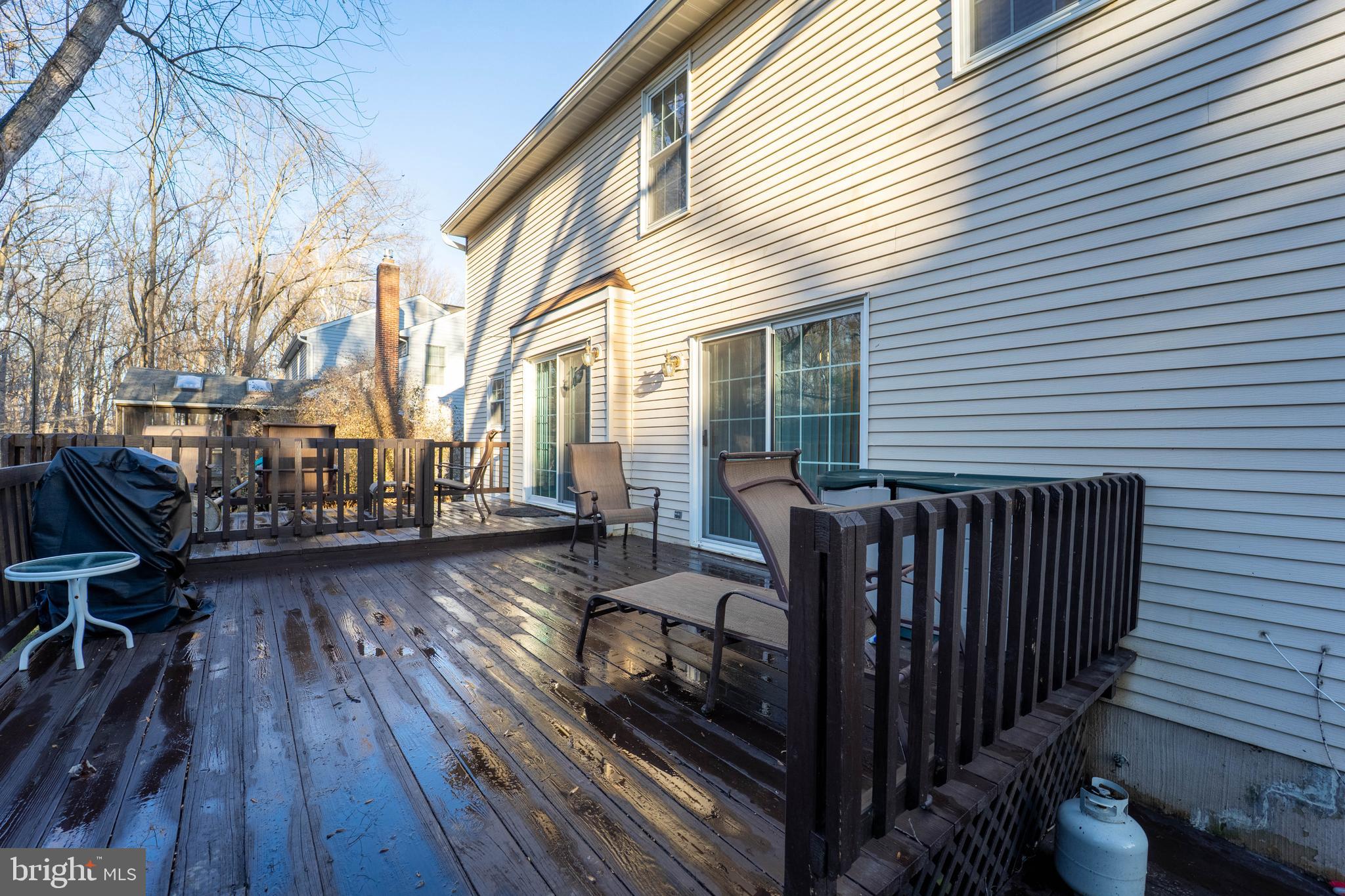 10531 Hunters Way Laurel, MD 20723 - Photo 40 of 42 a view of balcony with wooden floor and outdoor seating