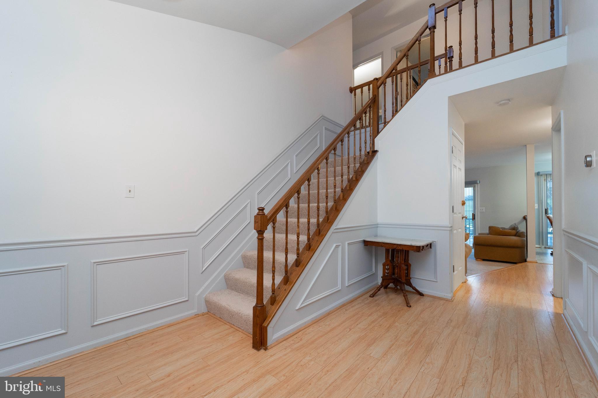 10531 Hunters Way Laurel, MD 20723 - Photo 4 of 42 a view of entryway and hall with wooden floor