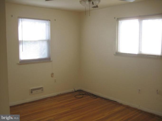4835 Melbourne Road Baltimore, MD 21229 - Photo 6 of 7 an empty room with a window
