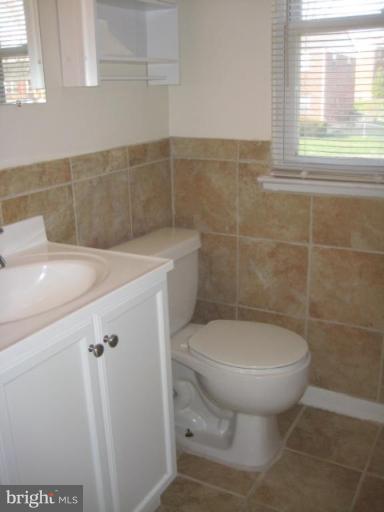 4835 Melbourne Road Baltimore, MD 21229 - Photo 7 of 7 a bathroom with a sink and toilet