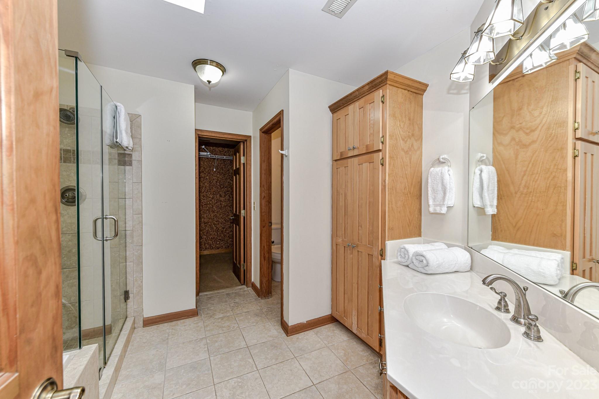 7911 Sims Road Waxhaw, NC 28173 - Photo 16 of 48 a bathroom with a sink and a mirror