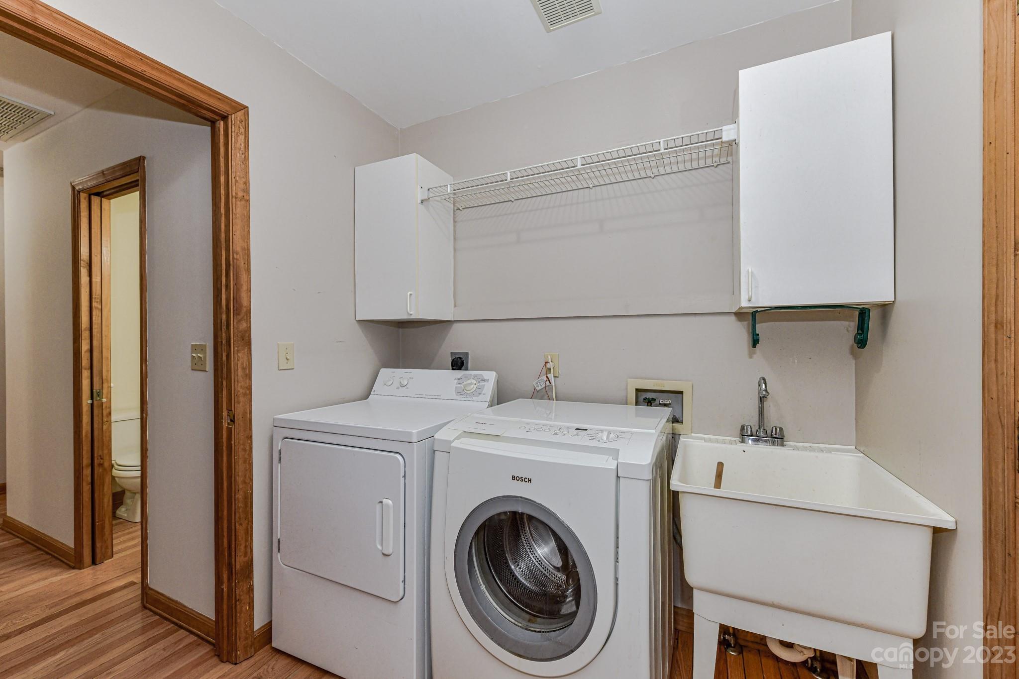 7911 Sims Road Waxhaw, NC 28173 - Photo 18 of 48 a utility room with dryer and washer