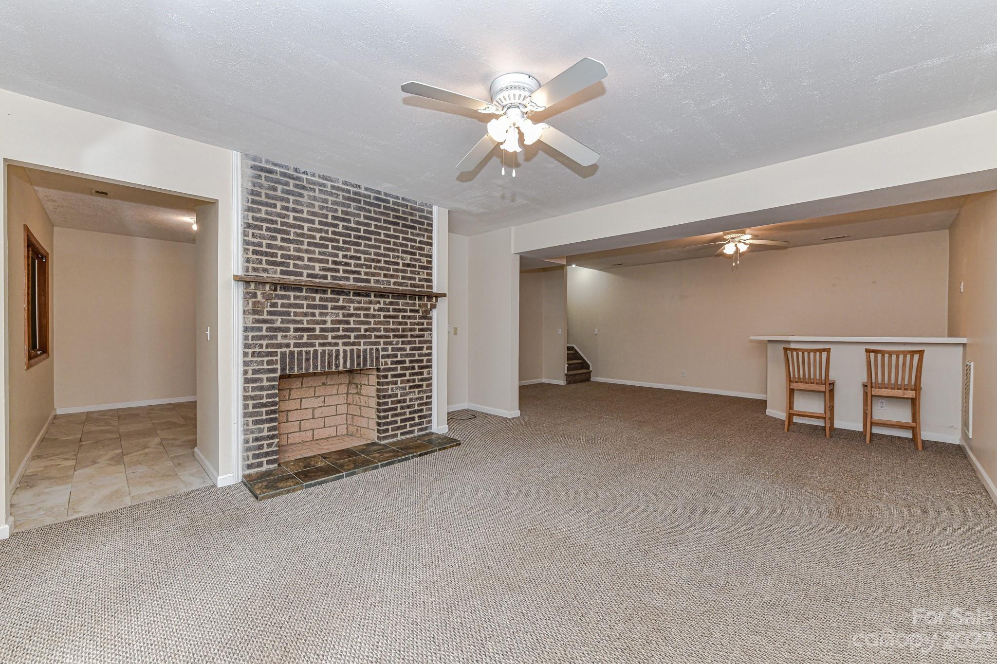7911 Sims Road Waxhaw, NC 28173 - Photo 22 of 48 a view of an empty room with a ceiling fan