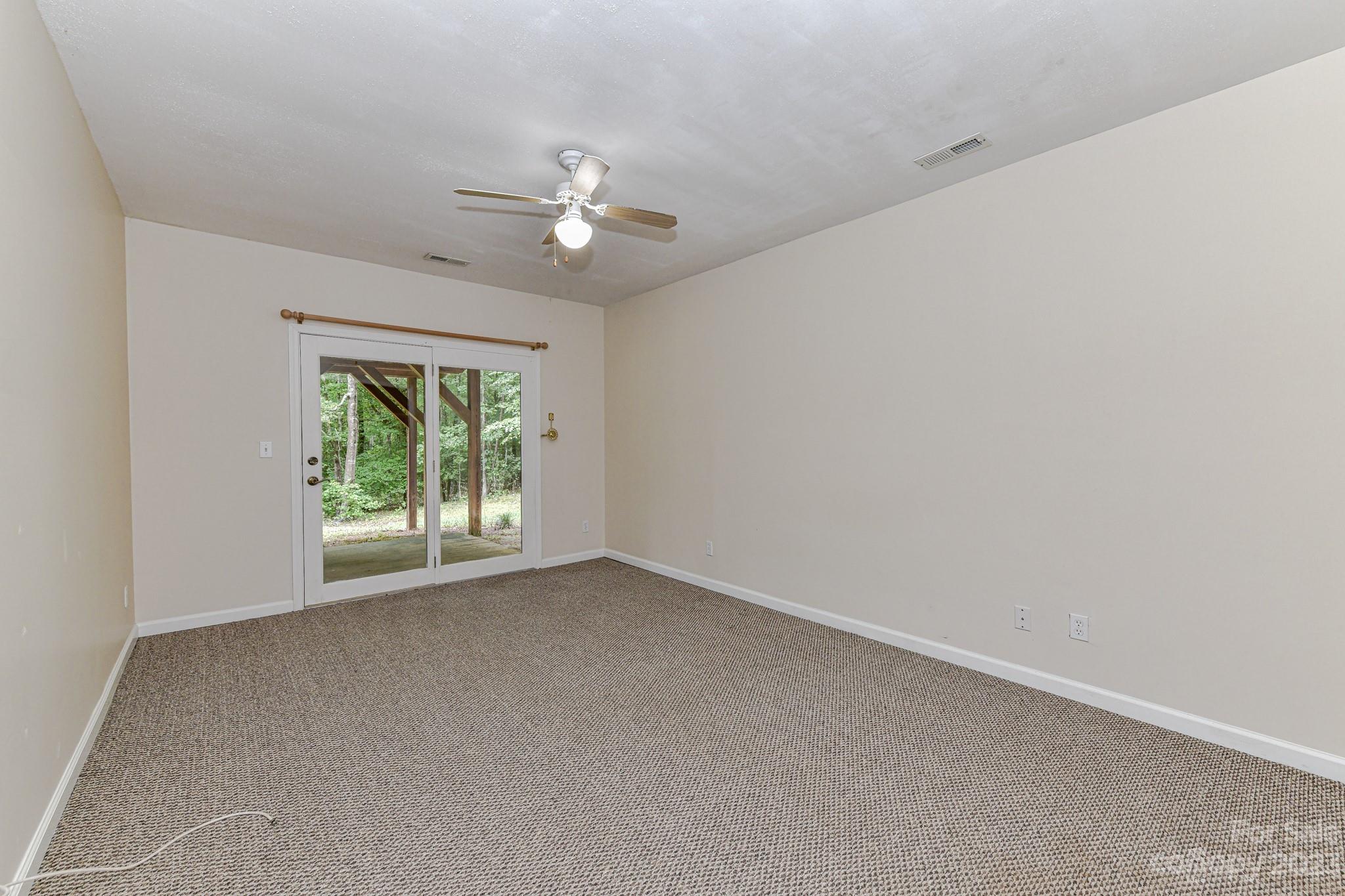7911 Sims Road Waxhaw, NC 28173 - Photo 27 of 48 an empty room with a window