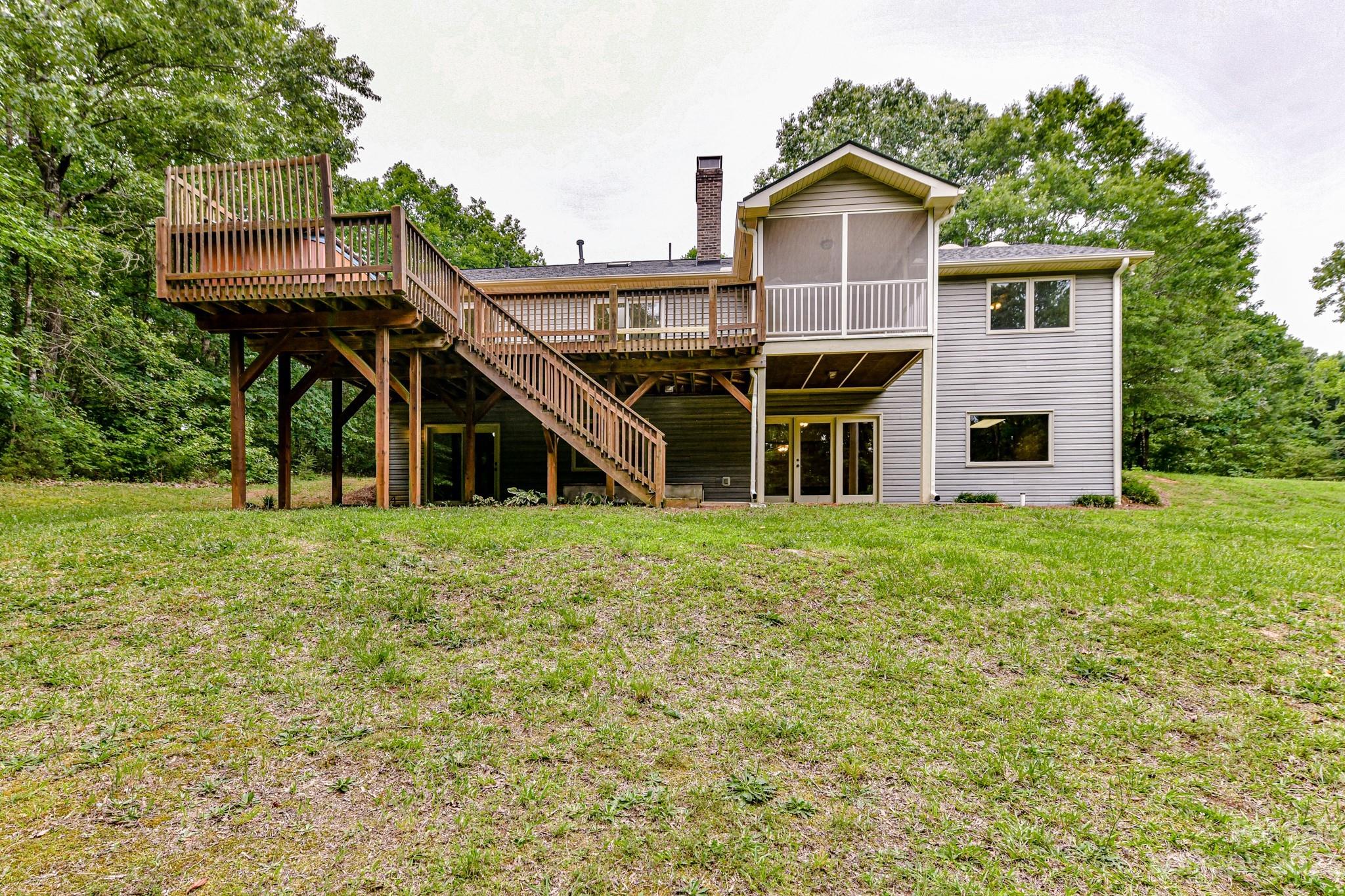 7911 Sims Road Waxhaw, NC 28173 - Photo 37 of 48 a front view of a house with a garden