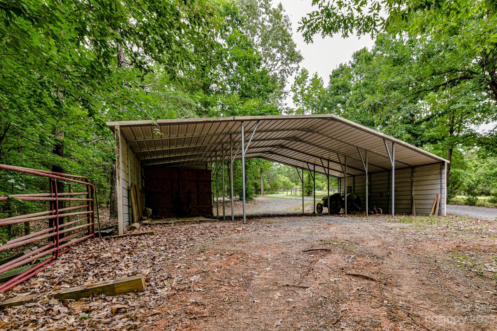 7911 Sims Road Waxhaw, NC 28173 - Photo 38 of 48 a backyard of a house with lots of green space