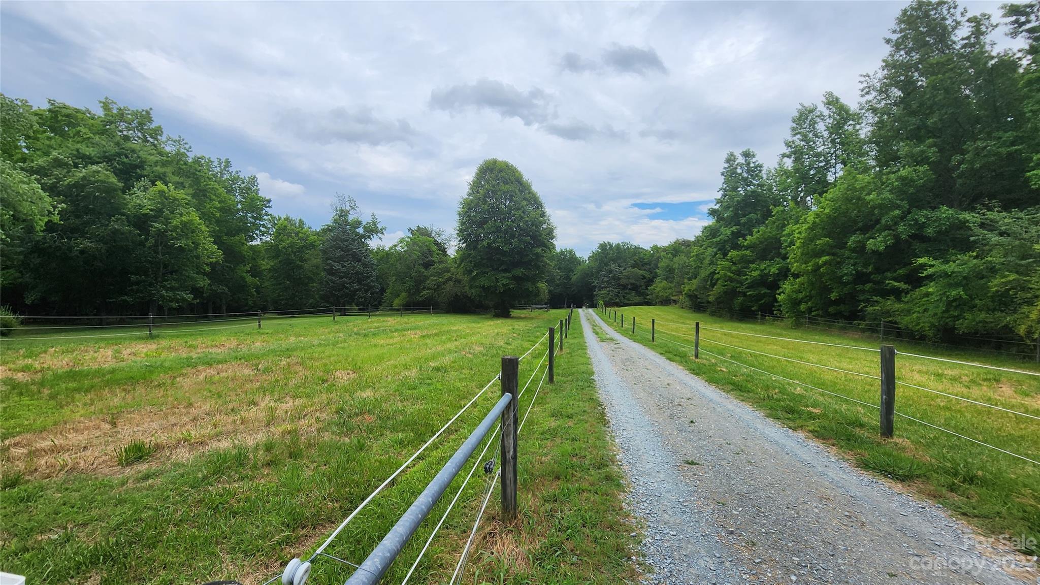 7911 Sims Road Waxhaw, NC 28173 - Photo 42 of 48 a view of a garden and basketball court