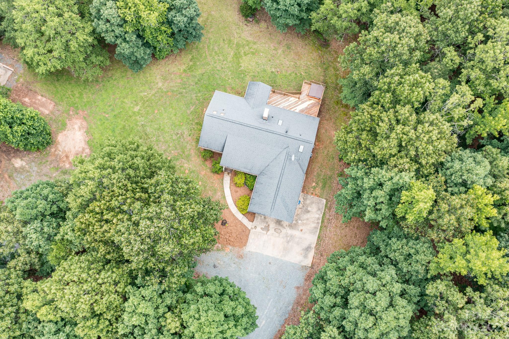 7911 Sims Road Waxhaw, NC 28173 - Photo 43 of 48 an aerial view of a house with a lake view