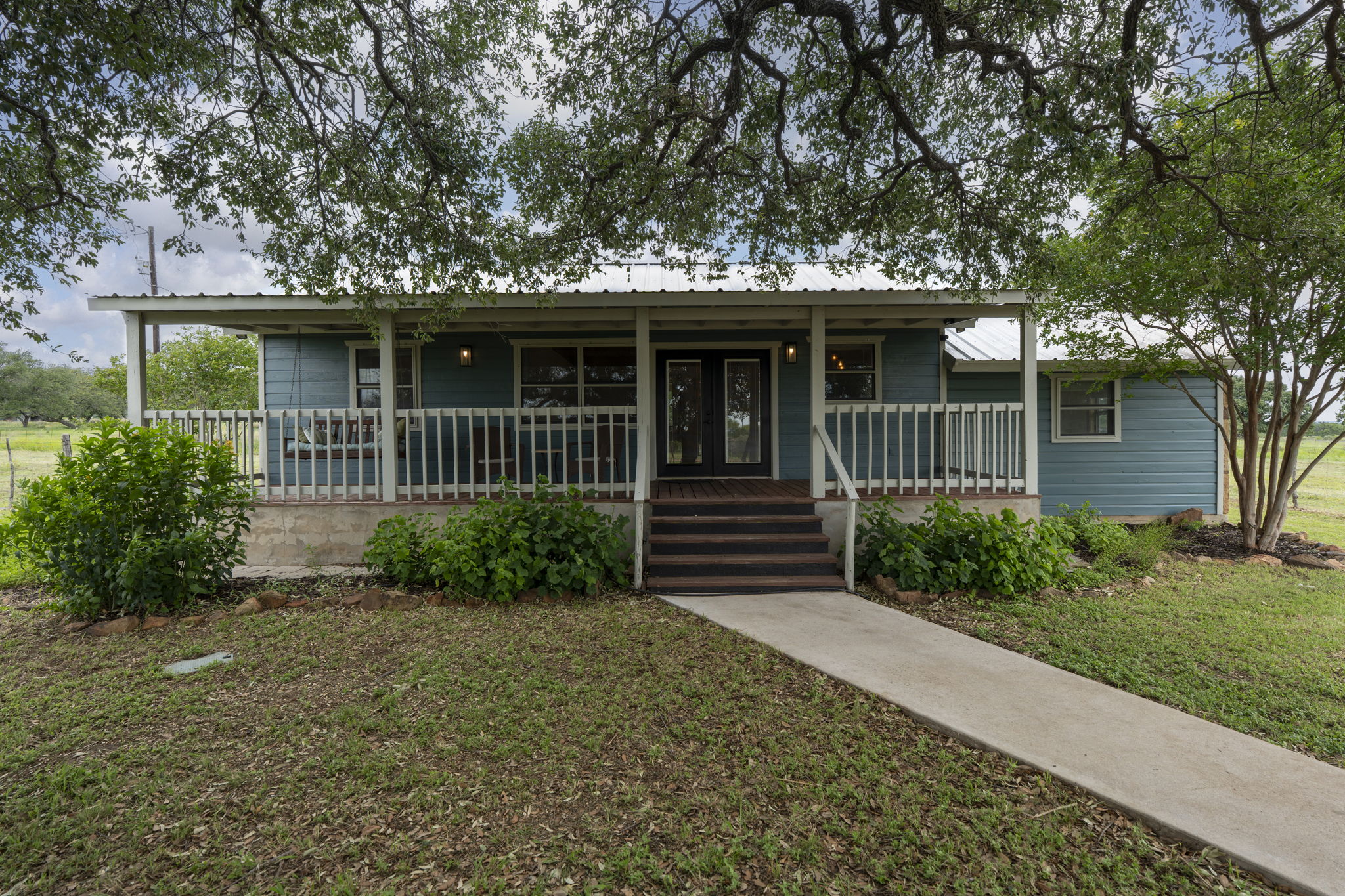 225 Ischar Lane Mason, TX 76856 - Photo 2 of 37 a front view of a house with garden