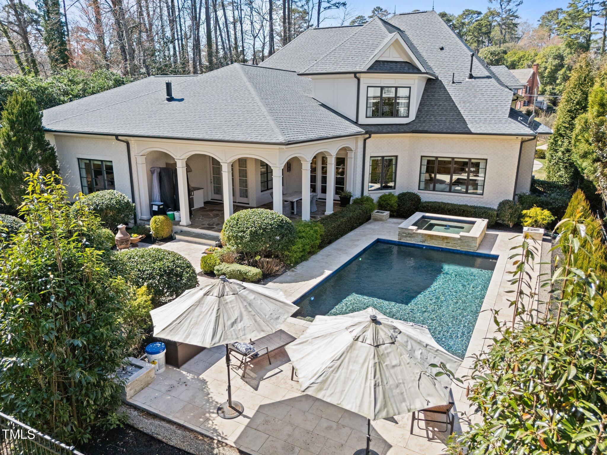 2710 Cambridge Road Raleigh, NC 27608 - Photo 19 of 20 a aerial view of a house with swimming pool and glass windows