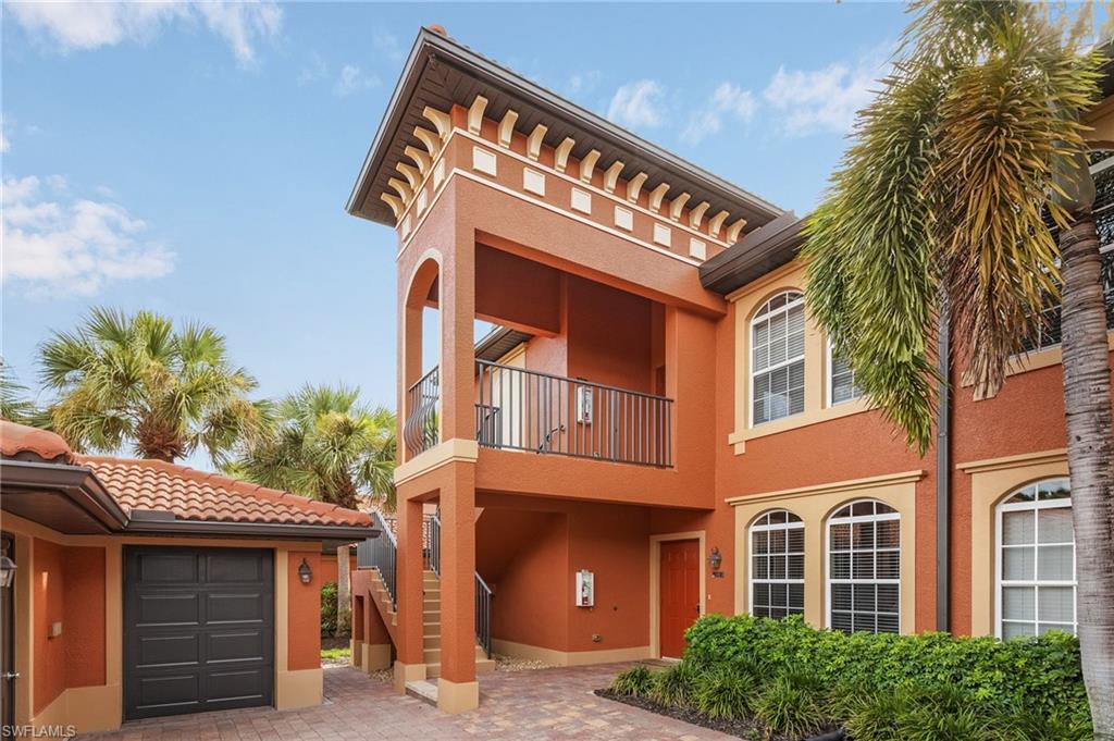 10045 Heather Lane, Unit 203 Naples, FL 34119 - Photo 15 of 30 a view of a building with a tree